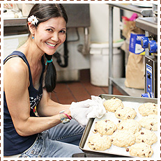 A photo that shows what Kaila looks like next to an oven baking scones